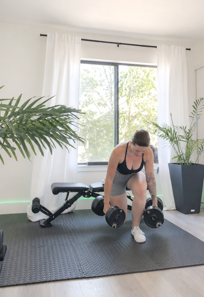 Woman doing fitness exercises in her home gym